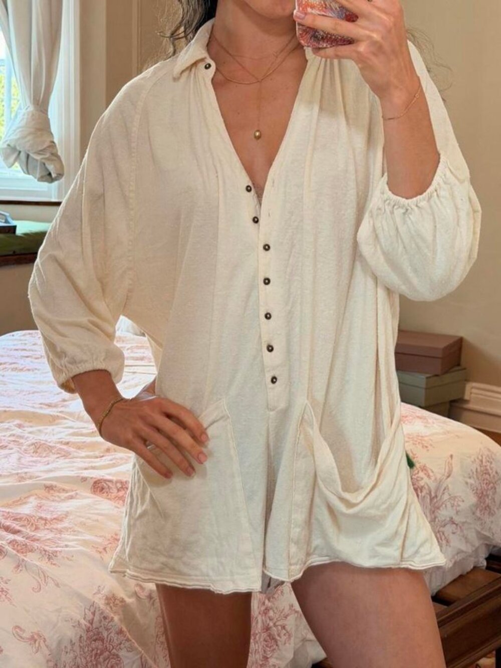Cream white romper from Urban Outfitters with boucl like texture and button